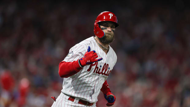 Bryce Harper rounds the bases after a home run.